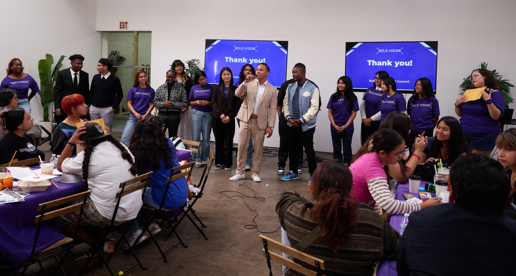 Attendees gather for a closing session beneath a Thank You banner at the October Youth Summit.