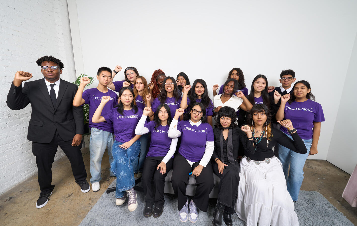 The Bold Vision Youth Council poses together in purple shirts at the October Youth Summit.