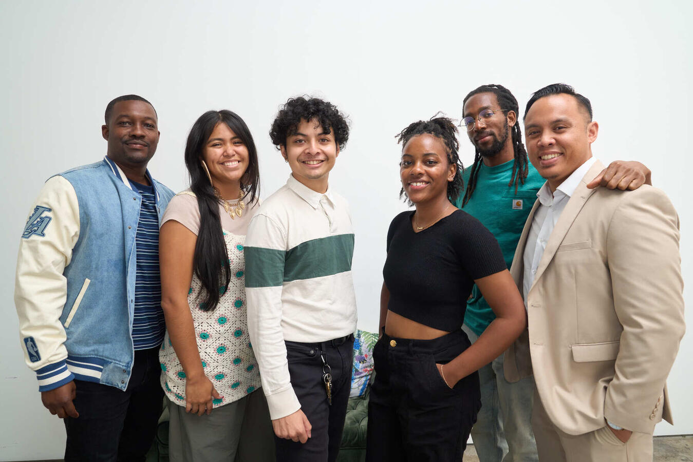 A group of five poses together at the October Youth Summit.