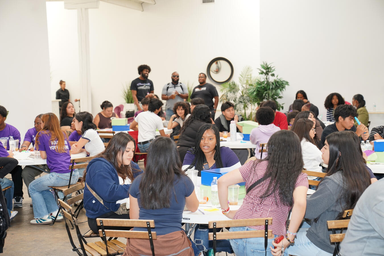 Attendees work together at tables during a breakout session at the Bold Vision Youth Summit.
