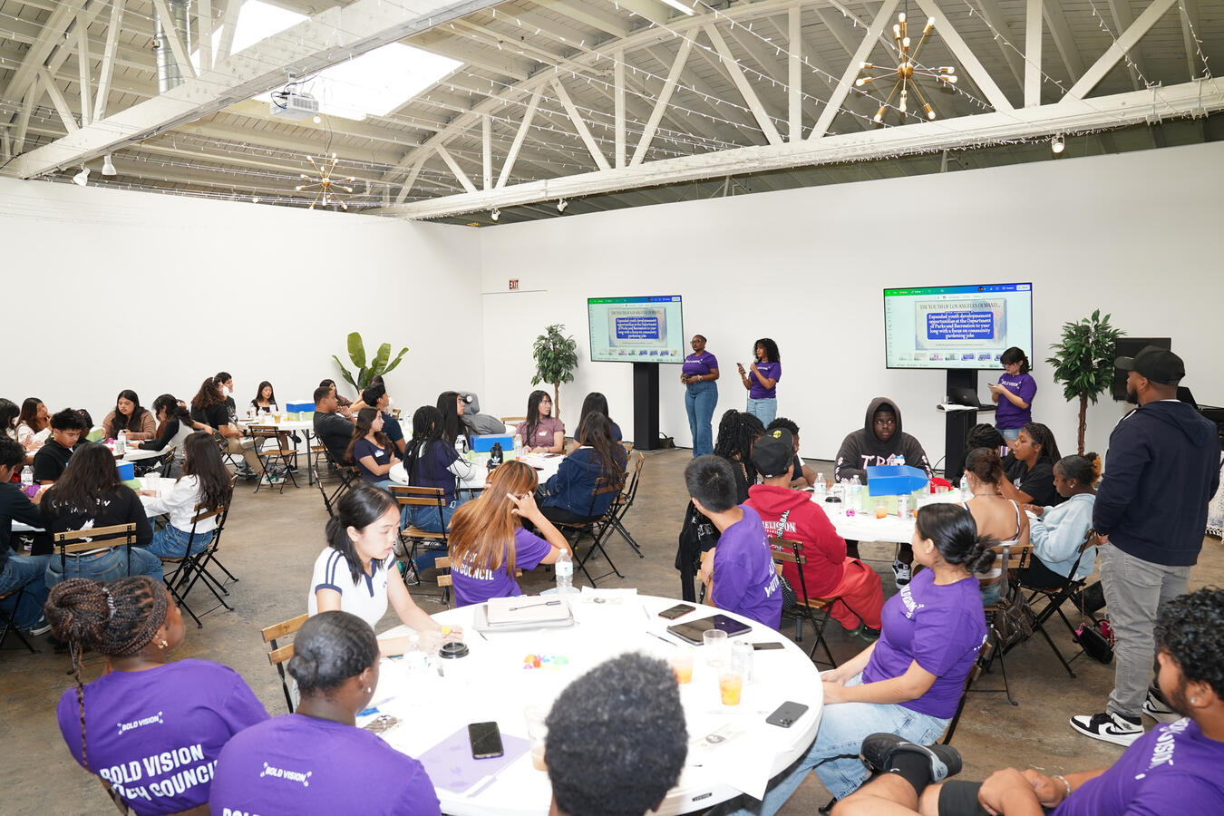 Attendees fill round tables during a workshop session at the Bold Vision Youth Summit.