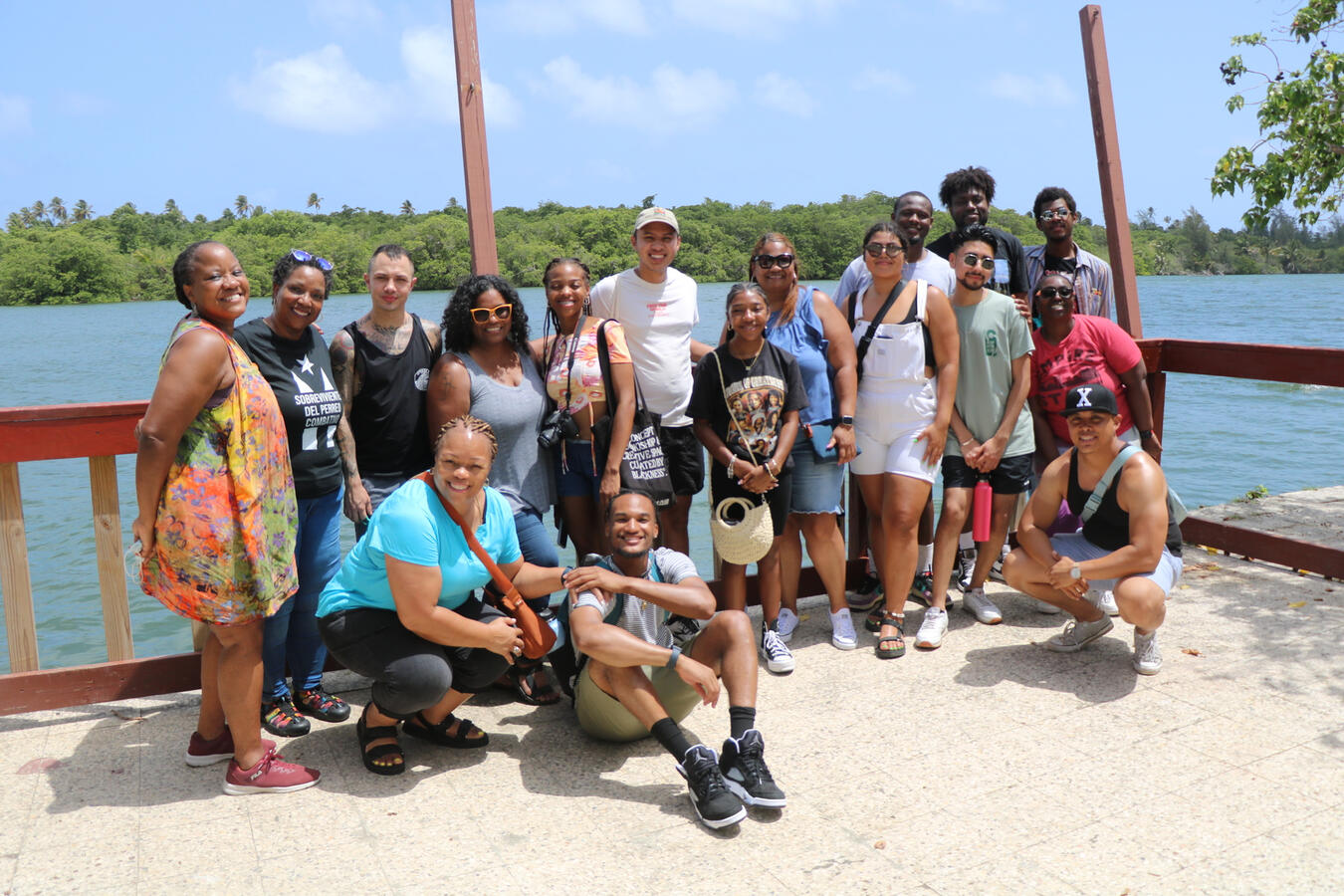 The fellowship cohort poses together on a dock overlooking the water in Puerto Rico.