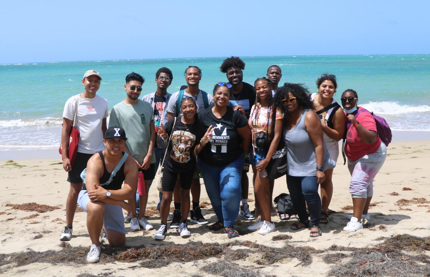 The fellowship cohort poses together on a beach in Puerto Rico.
