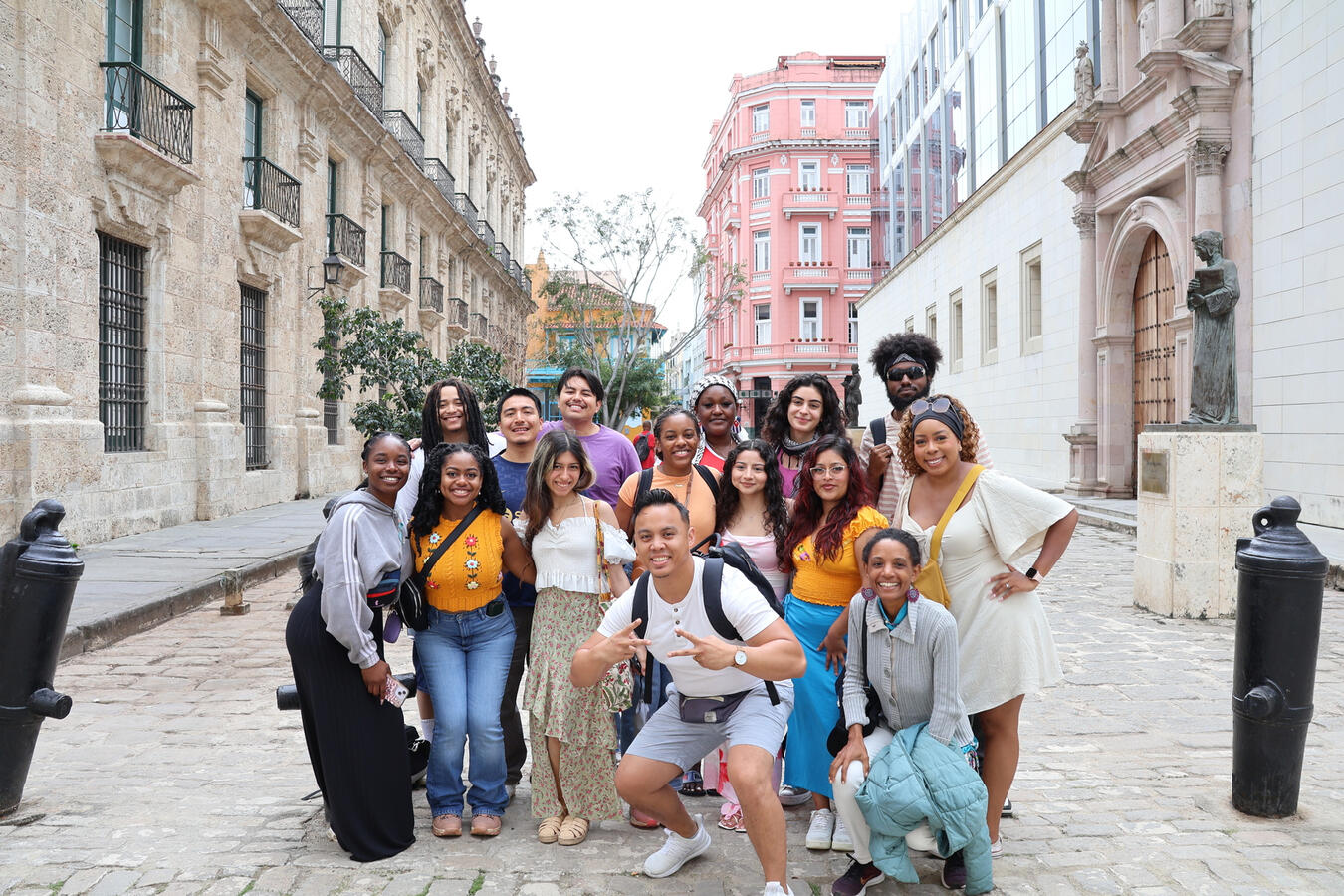 The fellowship cohort poses together on a colonial-era street in Old Havana.