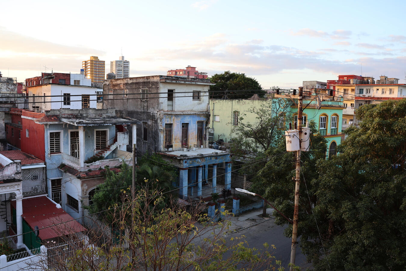 Havana Skyline at Dusk Rooftops and colorful building facades in Havana at dusk.