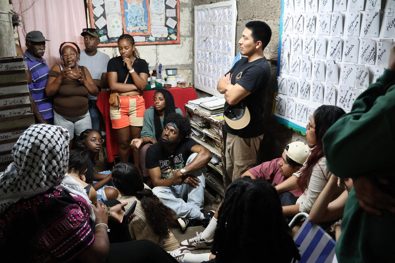 Delegation members join a drumming and music session with local musicians.