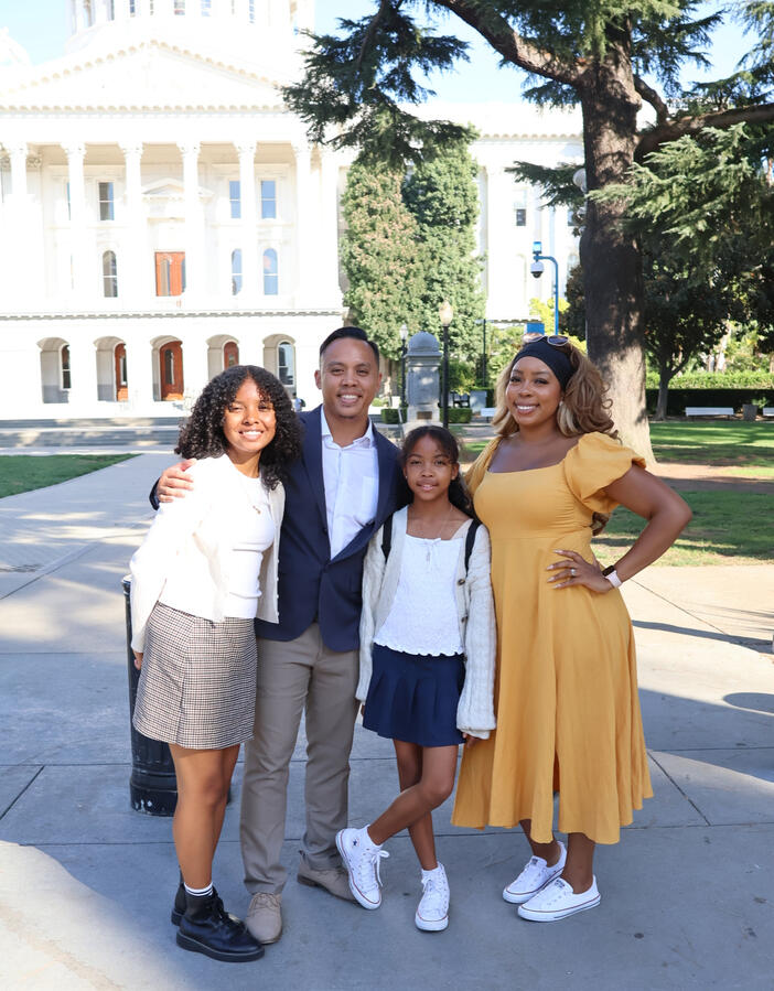 Gabriel Regalado with His Family at the Capitol Gabriel Regalado stands with his wife and daughter outside the California State Capitol.