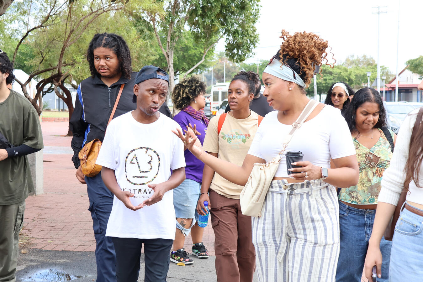 Delegation members stand together outdoors during a break in the South Africa fellowship.