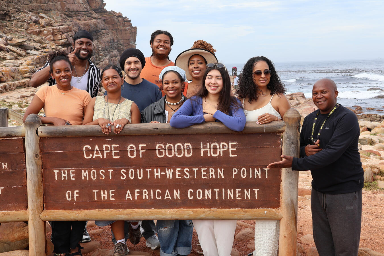 Delegation at the Cape of Good Hope The delegation poses together at the Cape of Good Hope sign marking the southwestern point of Africa.