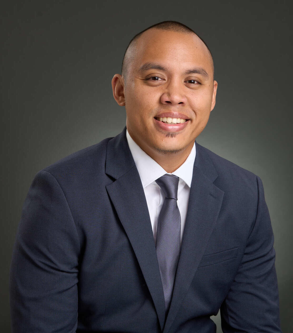 Gabriel Regalado, Professional Headshot (Option 3) Professional headshot of Gabriel Regalado smiling directly at the camera in a navy suit.