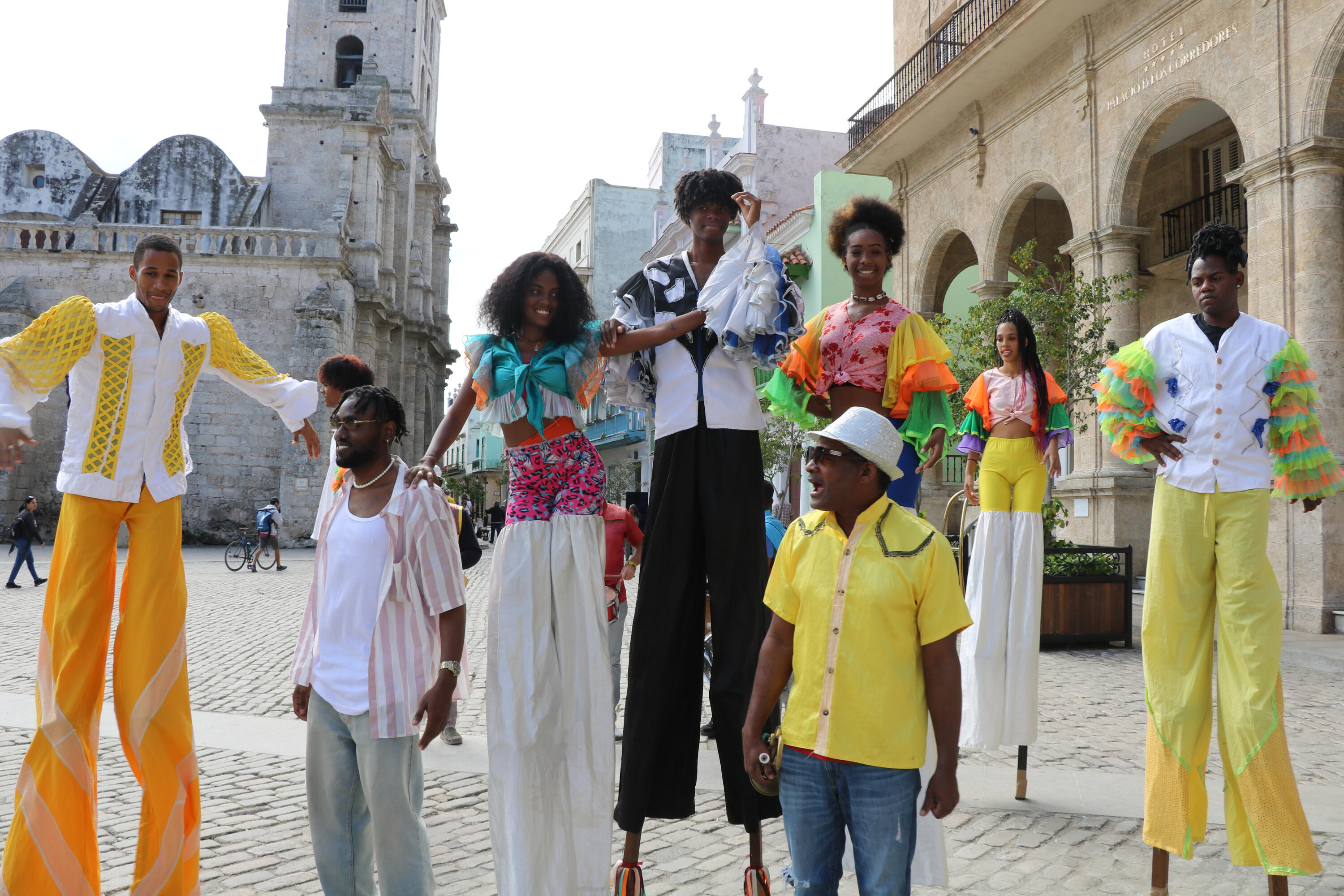 Stilt Performers in Old Havana Costumed stilt walkers perform in a plaza surrounded by colonial architecture in Old Havana.